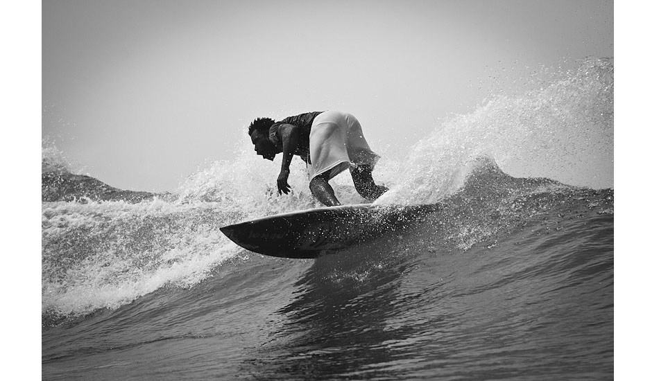 Augustin Togbe- surfer, soccer player, and powerhouse- puts it on a rail. Photo: Sean Brody
