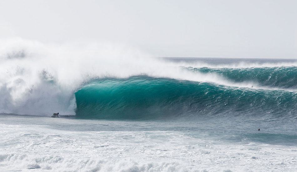 Every time, I see big, perfect waves being ridden, I have to remind myself to step back and shoot a few pulled back images before getting into the routine of shooting any tight action on the big lens. It\'s so often more important to get these pulled back images than it is to go tight.  In fact, I\'m more likely now to shoot the pulled back image than the tight image simply because the pulled back image is more likely a line up and those are timeless. This is Evan Valiere on one of those timeless waves with an absolutely timeless bottom turn. Photo: <a href=\"https://seandavey.com//\" target=_blank>Sean Davey</a>