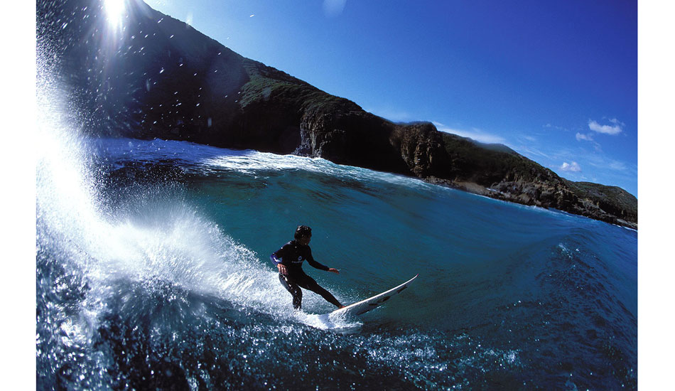 We were on a road trip for Surfing and Tracks magazines, driving around Tasmania to the best spots on the day. This particular day had us arriving really much later than I wanted, because I knew the steep hills would block off the sunlight early to this location.    I jumped into the water with my water housing and made a bee-line for the tube zone, quickly followed by Kahea. Looking up the hill at the sun, you could see that it was going to go over the hill in mere minutes, so we set about getting as many pics as we could knowing that our visual window of opportunity was going to be short. It\'s situations where you look at it and just know that you have to do everything you can right there and then to make the images happen. Photo: <a href=\"https://seandavey.com//\" target=_blank>Sean Davey</a>