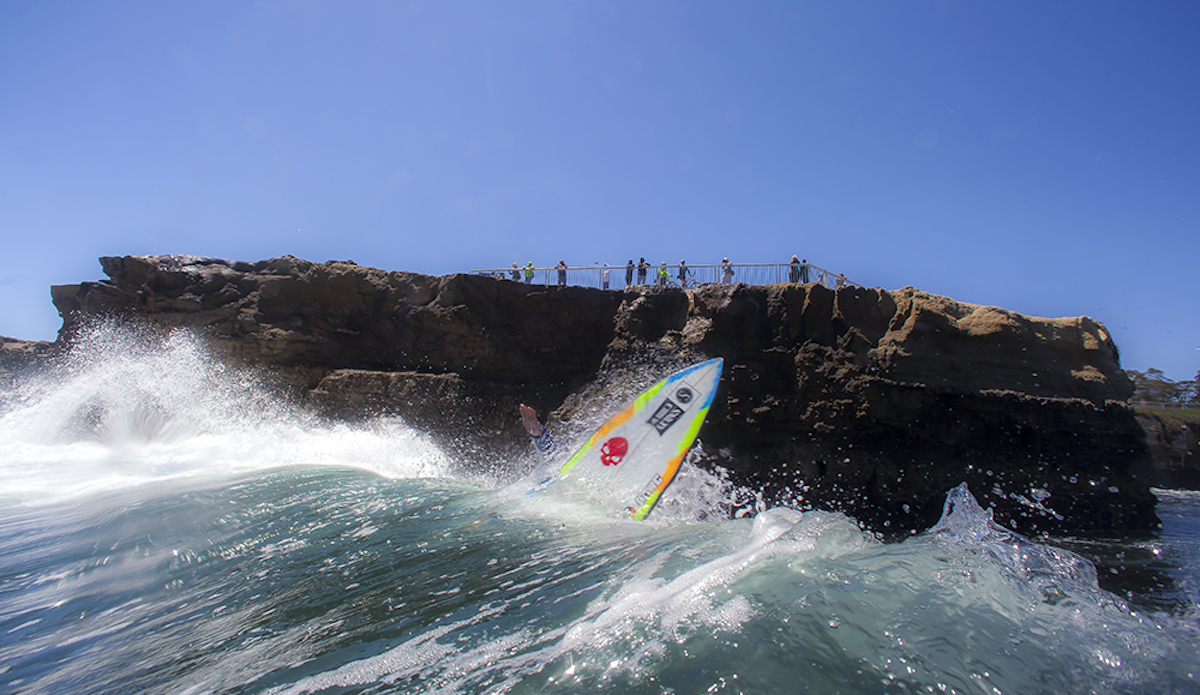 The youth of Santa Cruz show travelers and spectators alike that surfing inches from cliffs can be as natural as circular planets. (Note: this surfer is an identified.  If you can identify him correctly you will win surf art from edasurf.com • #waterthewall)