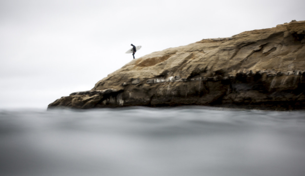 When approaching the waters of \'Steamer Lane\', never use the stairs.  Proper entrance etiquette dictates two courses.  The first (pictured) is to hop the fence by the museum and walk down the smooth cliff directly in the lineup. Photo: Sean Ruttkay