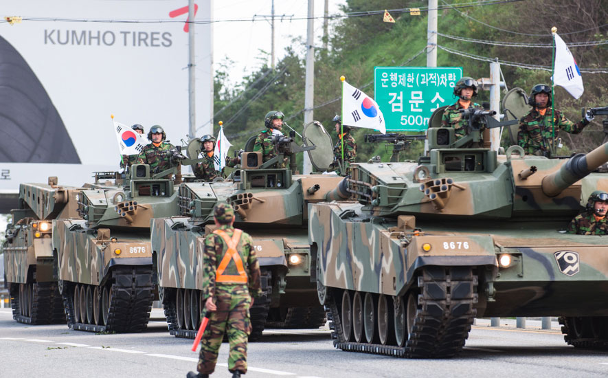 ROK tanks parade down the highway during a military exercise and parade day which celebrated a South Korean military memorial. The Army is always present in this heavily-defended area. Photo: <a href=\"https://www.shannonaston.com/\" target=_blank>Shannon Aston</a>.