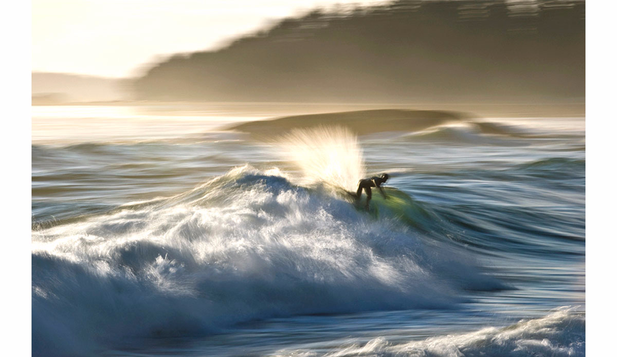 Tofino spray. Photo: <a href=\"https://beachbreakphotography.ca/\">Shayne Stadnick</a>