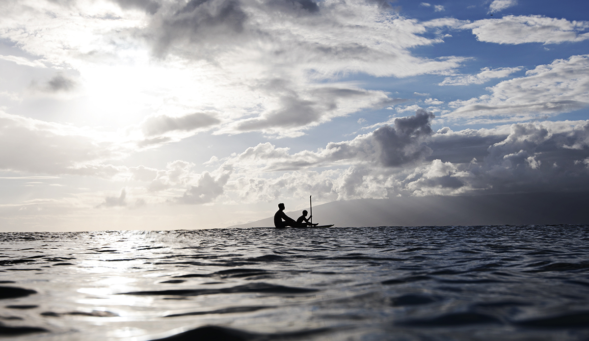 A father teaches his son the finer points of paddling. Maui, Hawaii. Photo: Sheldon Magner