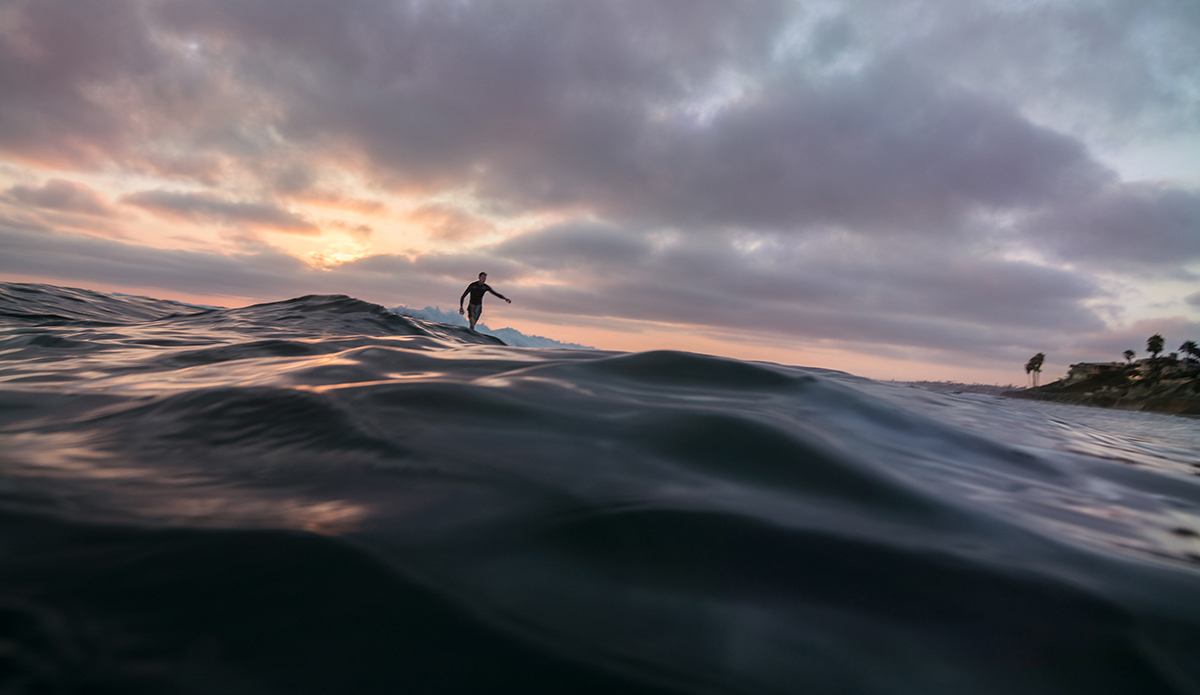 Sam Cadwallader logging through a San Diego summer sunset.  Photo: Sheldon Magner