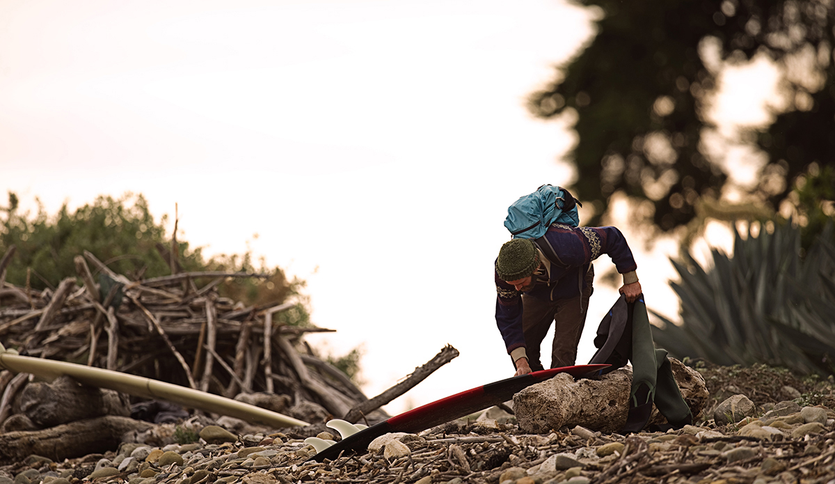 Unknown surfer getting ready for a sunset surf. Rincon, CA.  Photo: Sheldon Magner