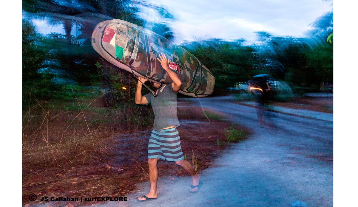  A trip is not all fun and waves, hauling boards after a long travel day of boats and cars. Photo: <a href=\"http://surfexplore.info/\">surfEXPLORE</a>/John Seaton Callahan