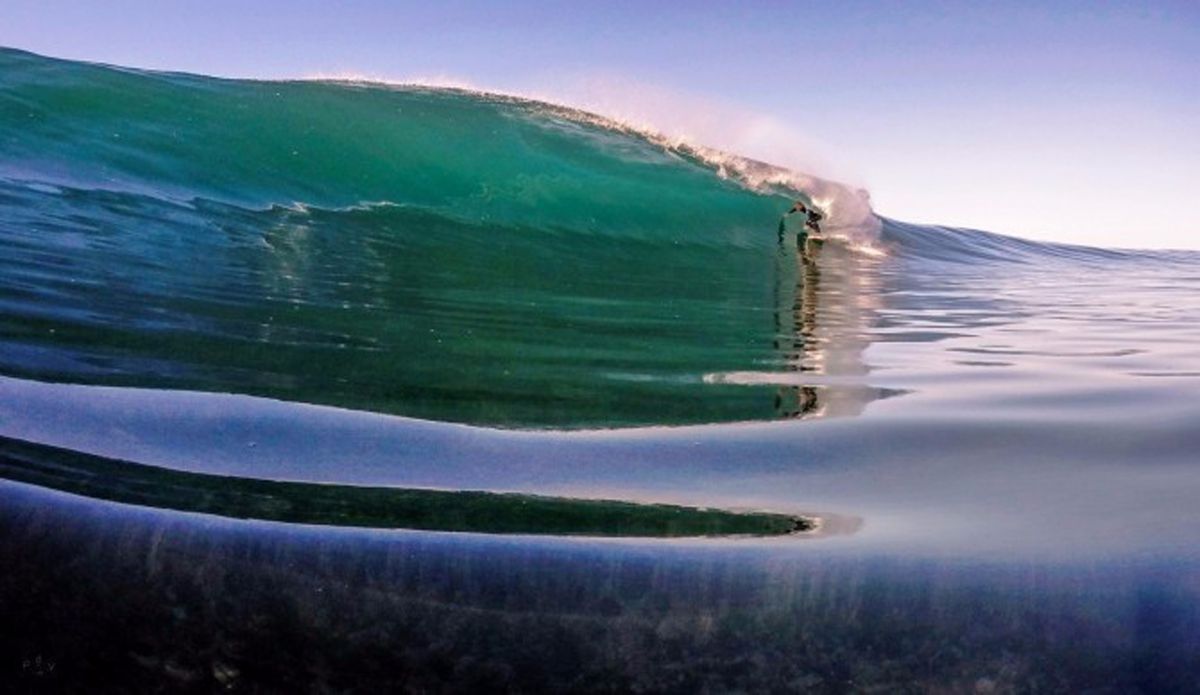 Devyn Mattheys gliding over the barely-submerged ledge. Photo: <a href=\"https://www.facebook.com/pages/Pierre-de-Villiers-Water-Photography/810937898938872\">Pierre de Villers</a>
