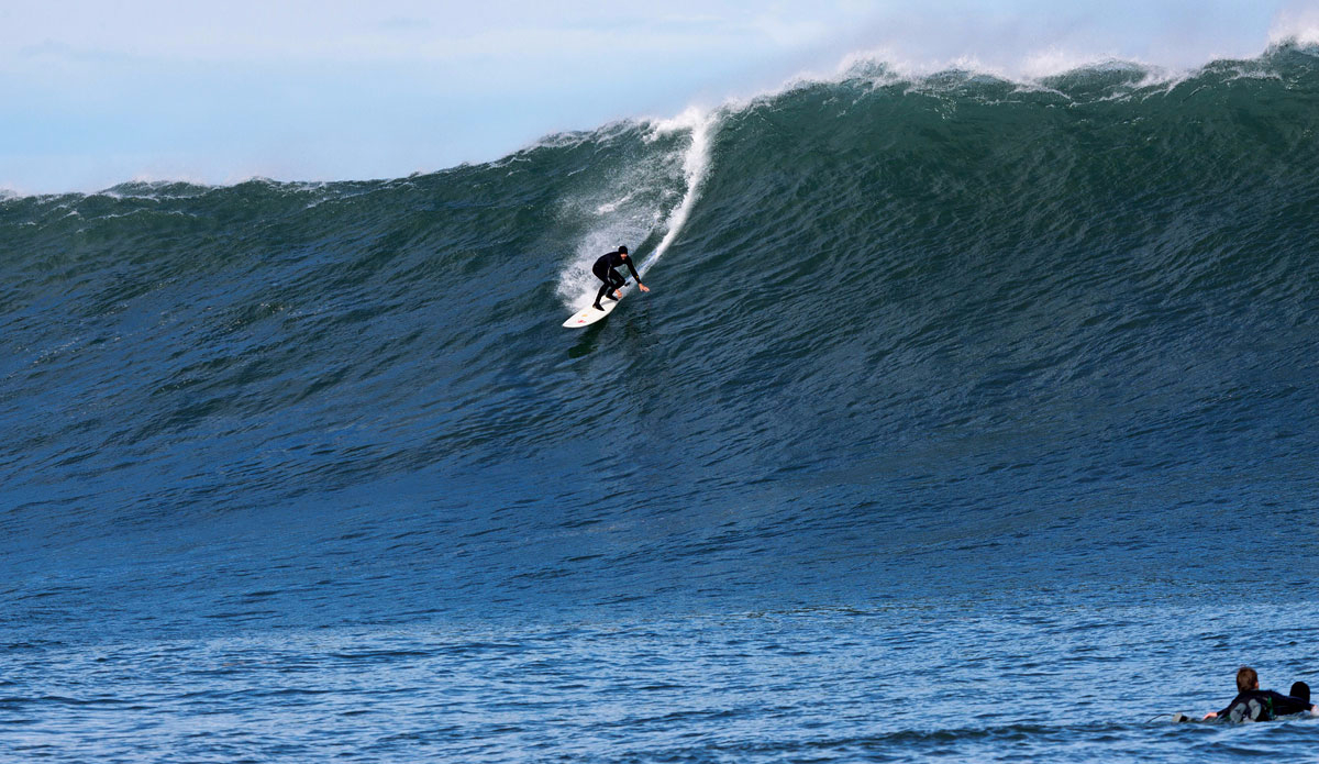 Kohl Christensen, setting the rail of his 10’-6”, deep in a sizeable chunk of North Atlantic. Photo: <a href=\"https://semeyadetoral.com/\"> Manuel Toral</a>