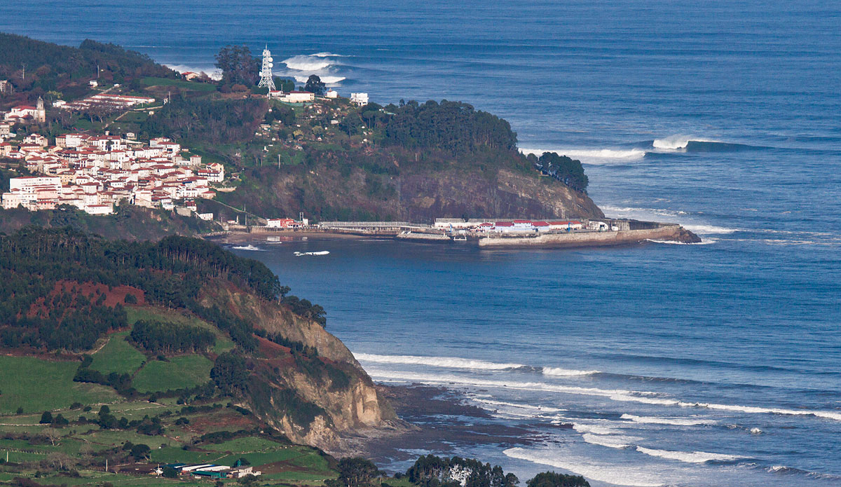 Two extraordinary big wave reefs, breaking in unison on a large, clean morning, as takers wait for the tide to drop.  I took this image from a nearby mountain range, while standing at 3000 feet above the ocean.  Not every day does one get to enjoy mountains of water from a mountain.
 Photo: <a href=\"https://semeyadetoral.com/\"> Manuel Toral</a>