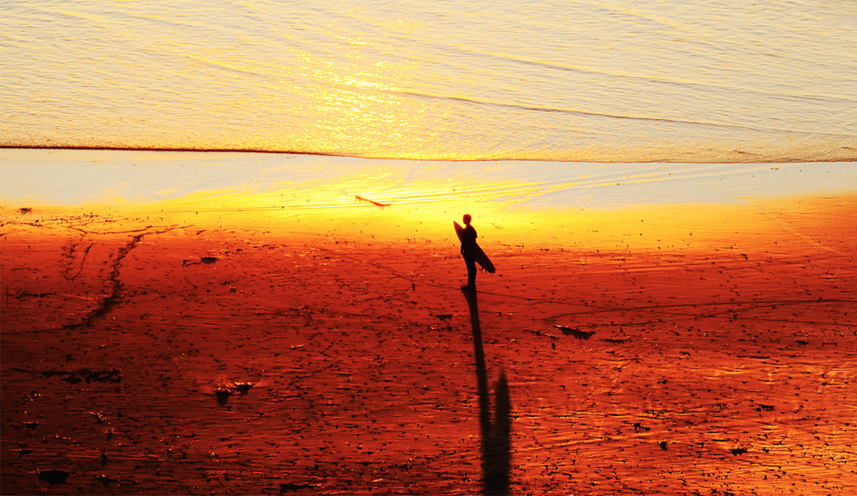 Sunsets in Laguna Beach are my favorite. A surfer gazes back at the ocean after his session. Photo: <a href=\"www.kgfoto.com\">Katie Graham</a>