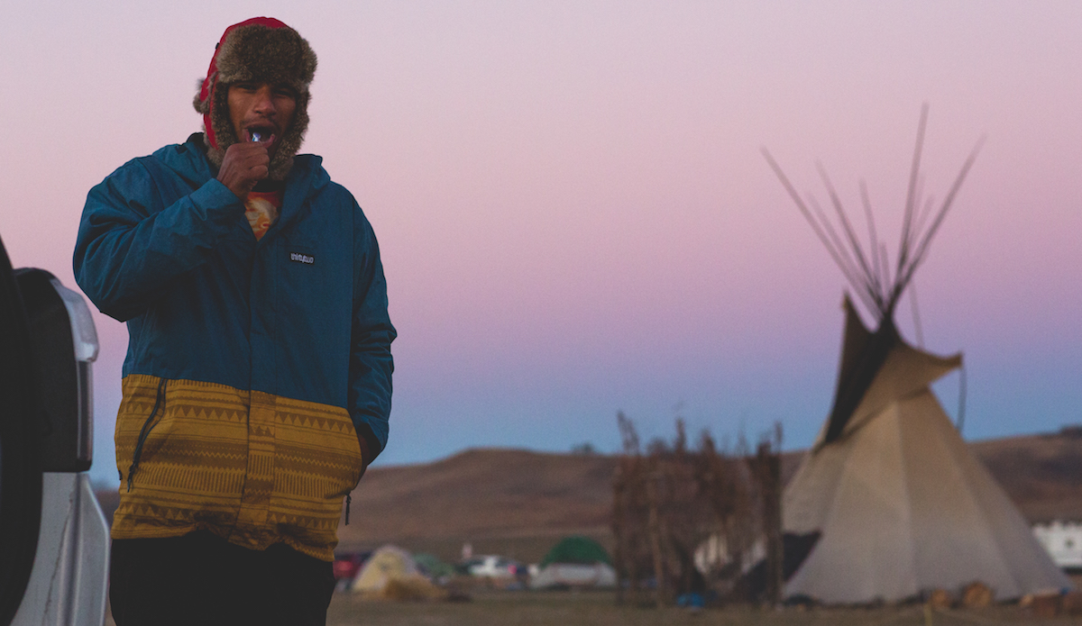 Also traveling with us was Teva Dexter, Tahitian via Hawaii, to come show his solidarity with the Standing Rock Sioux. We woke up the next morning after a shockingly freezing night of sleep (most of us barely slept as we were massively unprepared for the 28 degree temps). Photo: Keegan Gibbs
