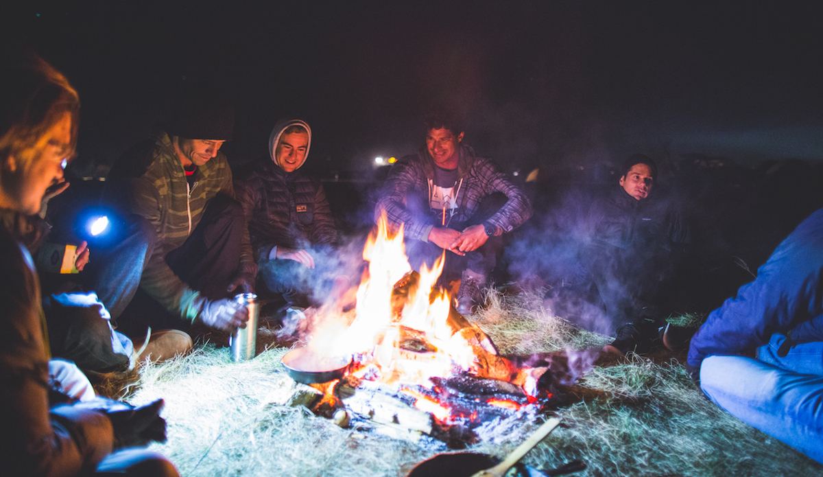 Our group huddling around our small camp fire in the below freezing conditions at night, boiling some water for tea before bed while we talk story of the day.   Photo: Keegan Gibbs