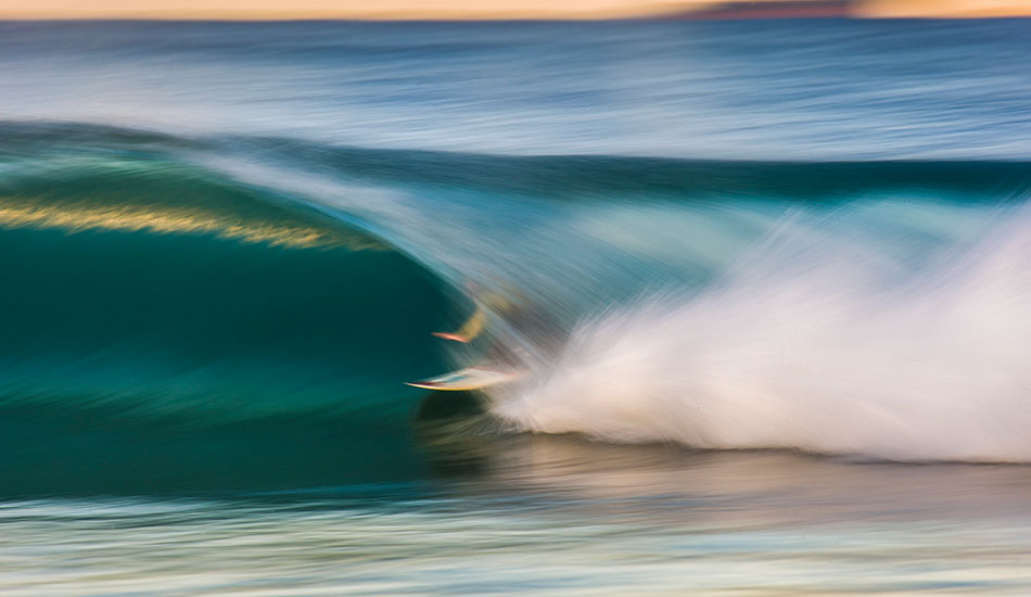 Kneerider Chayne Simpson blurs through a local creek mouth. Photo: <a href=\"https://www.16images.com.au\">Steen Barnes</a>