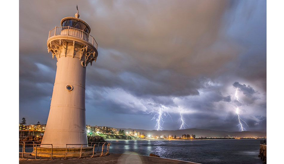 Wollongong’s Historical Lighthouse and a summer storm approaching. Photo: <a href=\"https://www.16images.com.au\">Steen Barnes</a>