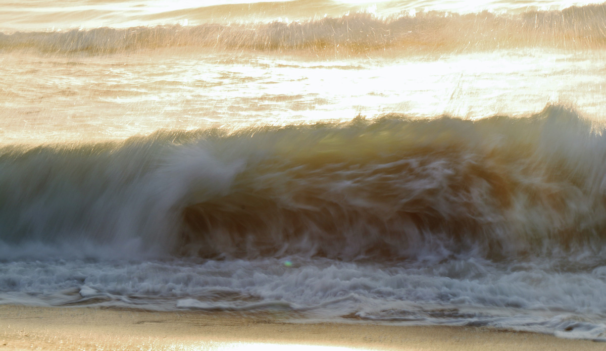 Gold. On this particular morning at the Entrance, mini golden slabs consistently rolled in across the face of a lit-up shore break. Photo: <a href=\"https://rickycavarra.com\">Ricky Cavarra</a>