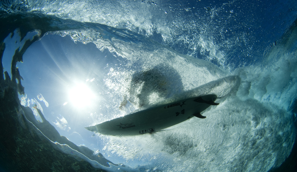 This is a shot from Tahiti in 2010. Brett Simpson flying overhead. Image: <a href=\"https://www.vincestreet.com\" target=\"_blank\">Street</a>