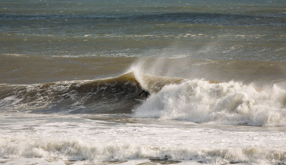Local Artist, John Glenn, sneaking into a cover up. There aren’t many people in Monmouth County that can find the barrel like John does. Photo: <a href=\"https://www.rozbernsurf.com\":> Kevin Strickland</a>
