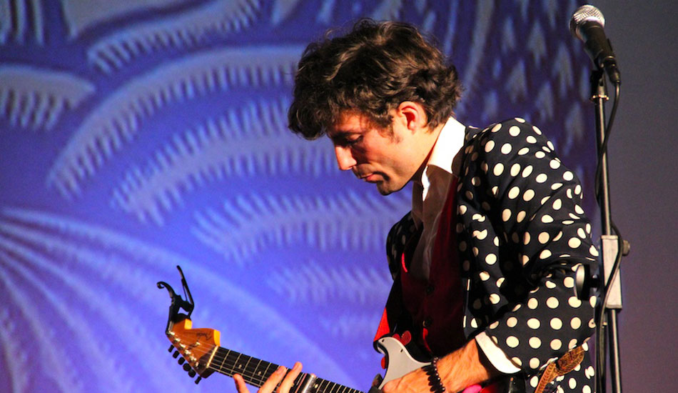 Guy Blakeslee in his spotted jacket. Photo: <a href=\"https://www.savethewaves.org\">Save the Waves</a>