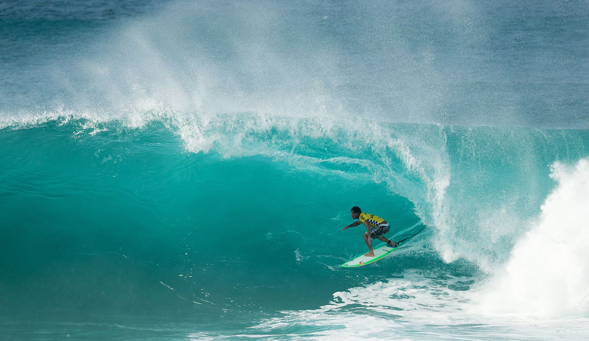 Michel Bourez of Tahiti (pictured) rides his heat winning barrel, scoring a near perfect 9.93 (out of a possible ten) to clinch the Vans World Cup of Surfing title at Sunset Beach, Oahu, Hawaii on Friday December 5, 2014.  Bourez defeated Dusty Payne (HAW), Sebastian Zietz (HAW) and Ian Walsh (HAW). Photo: ASP / Sloane