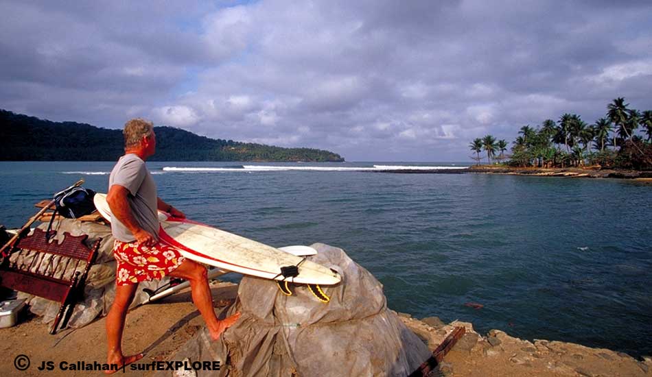 Sao Tome. Veteran surf traveler Randy Rarick waxes up and checks
the lineup at Porto Alegre on the southern tip of Sao Tome island. Photo: John Seaton Callahan/surfEXPLORE