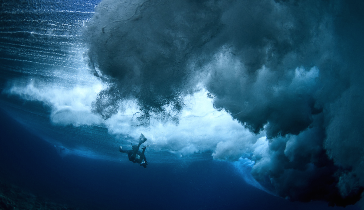 Getting caught on the inside while surfing Cloudbreak is no fun. But while swimming with a housing, the view isn\'t terrible. Photo: <a href=“ www.rookemedia.com”>Tyler Rooke</a>