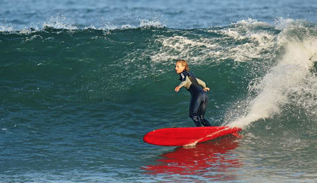 The Queen of switch stance, Carla Rowland Zamora (@carlafina). Going switch is one of my favorite things to do on a log. As a goofy-footer who loves rights, going switch helps me make critical sections and drive
down the line. It\'s an old art form, and when perfected, it\'s very sweet. Carla, my mentor and friend, shared this very special trick with me at a young age. You can catch her at the Bu doing switch tens and beating sections. Here\'s Carla making the switch look too easy while gracefully bottom turning. Photo: John Slavin