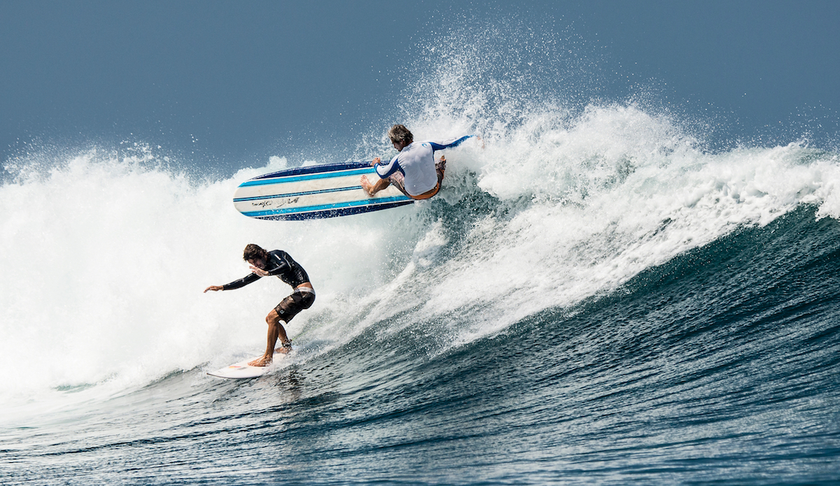 Namotu Island Resort, Nadi, Fiji (Thursday, February 25 2016): Taylor Hession (AUS) ducks for cover as  Mike Hennessy (HAW) rebounds off the white water above him. Both survived the move. A new North West swell was hitting this morning with very light variable winds. Virtually all the breaks around the island were working depending on the tide with sessions at Namotu Lefts and Swimming Pools. The swell was in the 4\'-6\' range all day and it was stinking hot without any wind. Photo: <a href=\"https://joliphotos.com/\"> Peter Joli Wilson </a>