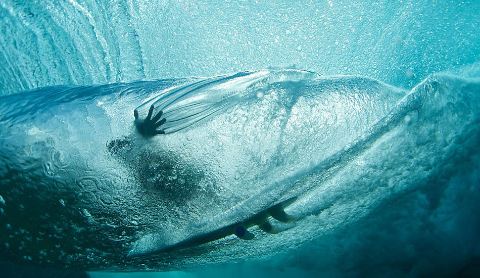 Underwater hand drag at Teahupoo. Photo: <a href=\"https://www.timmckennaphoto.com/\" target=_blank>Tim McKenna</a>.