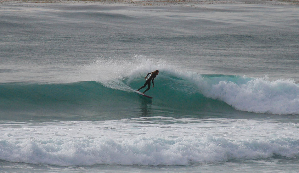 Sunday the swell had dropped a bit but the conditions were flawless all day long. Rob Machado’s smooth style is matched by smooth conditions on an unnamed reef in North County. Believe it or not, there were only four people surfing this break!