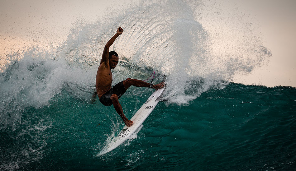 They say that traditional dancing has influenced the style of the Balinese surfers. Unfortunately that doesn\'t explain where Mega Semadhi got his break dancing skeels. Photo: <a href= \"https://tommyschultz.com/blog/category/photo-galleries/surf-photography-2/\">Tommy Schultz</a>