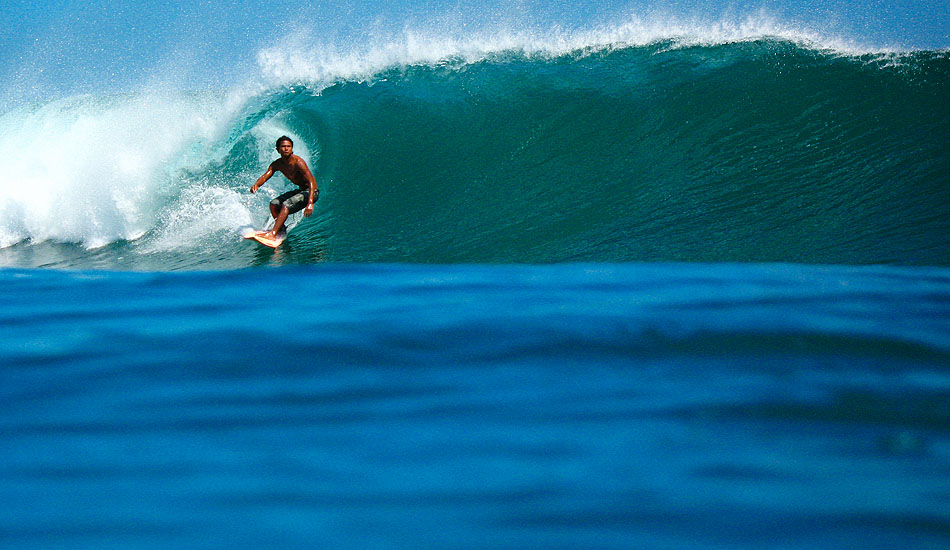 Eddy \'Bagus\' starts off his Saturday morning right with this perfect blue sloper in the Bali Bukit. Photo: <a href= \"https://tommyschultz.com/blog/category/photo-galleries/surf-photography-2/\">Tommy Schultz</a>