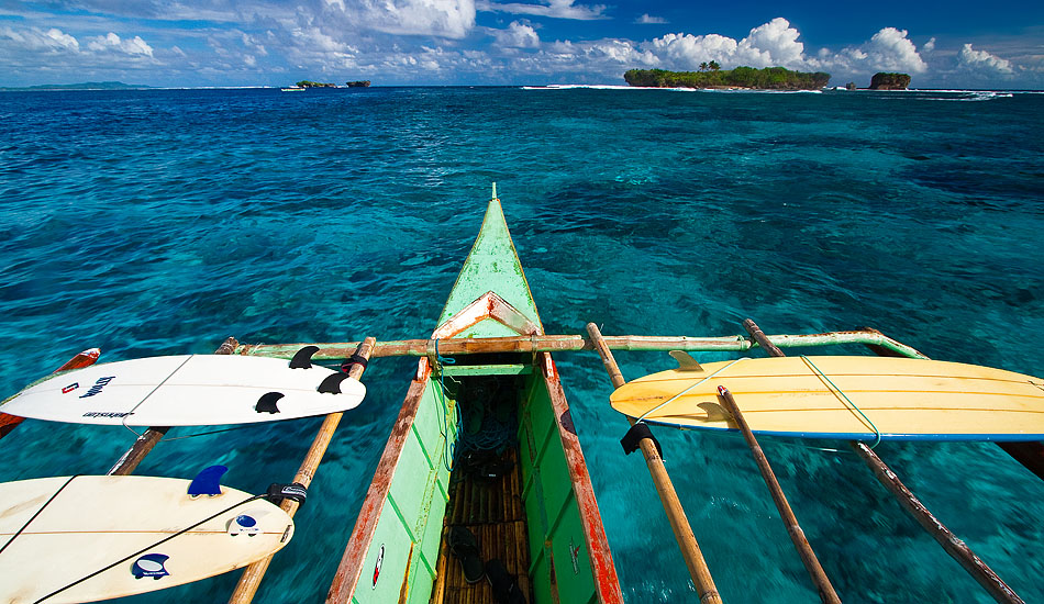 The bamboo outriggers on a Filipino \'bangka\' boat may have been designed for stability, but they\'re also pretty handy for carrying surf boards around a place like Siargao. Photo: <a href= \"https://tommyschultz.com/blog/category/photo-galleries/surf-photography-2/\">Tommy Schultz</a>