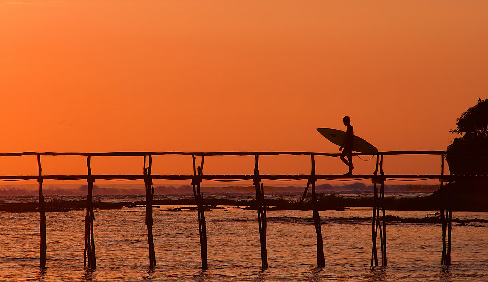 Cloud 9 in Siargao might have been named after a marshmallow and chocolate candy bar, but there\'s nothing tasty about its new nickname \'Crowd 9\'. When the rest of the island is sleeping off a few too many San Miguel\'s, you could be catching a Pacific sunrise (and uncrowded waves) like this guy heading out the pier at dawn. Photo: <a href= \"https://tommyschultz.com/blog/category/photo-galleries/surf-photography-2/\">Tommy Schultz</a>