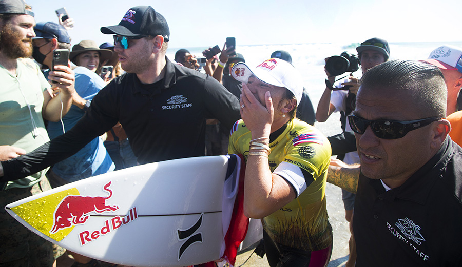 Carissa Moore, overcome by the weight of one of the greatest seasons in surf history.