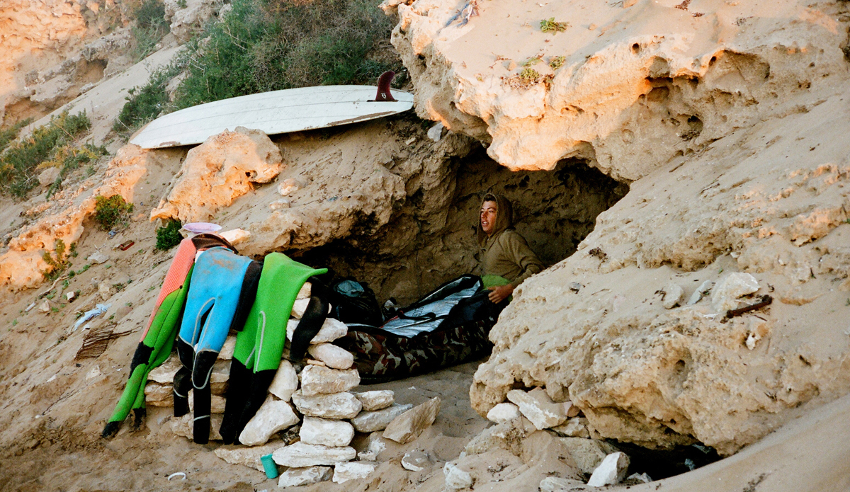 This is Ryan Burch in a Moroccan sand cave. We were on a trip with Thomas Campbell shooting for his new book and spent the whole day surfing here at this really fun spot… we couldn’t leave, so we spent the night and slept in our board bags. Central Morocco, 2014. Photo: <a href=\"https://trevorgordonarts.com\">TrevorGordonArts.com</a>