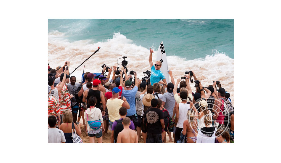 Adam Melling gets chaired up the beach as the 2012 World Cup of Surfing Champion. Photo: <a href=\"https://www.aspworldtour.com/\" target=_blank>ASP</a>
