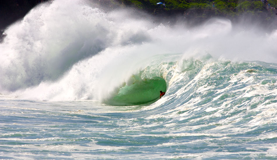 This is probably the most interesting shot with a story behind it as far as my history of shooting goes. This image was actually the last image on my card that I was using.  Andy had made a huge drop out the back and as he rode the wave through the midsection while Kelly was paddling back out watching him navigate the mid-section at Waimea Bay. I wake up every morning staring at this image on my bedroom wall. Thank you Andy for inspiring us again and again. Photo: <a href=\"https://tupat.posterous.com/\" target=\"_blank\">Patrick Eichstaedt</a>
