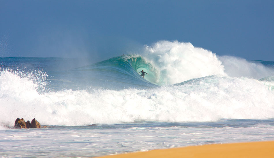 I was shooting Shea Lopez this day at Log Cabins on the North Shore of Oahu and kept looking down at Backdoor. Waves were in the 4-8 foot range and the conditions were perfect. I didn\'t want to miss any of Shea\'s waves, so I dug a big hole that I could sit low in and rotate left to right to get both angles. I remember seeing this bump come in and watching this unfold while holding down the trigger. Photo: <a href=\"https://tupat.posterous.com/\" target=\"_blank\">Patrick Eichstaedt</a>