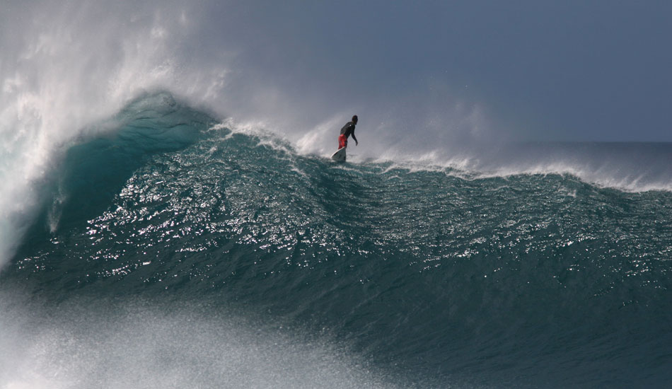 This was one of the most perfect days I have ever witnessed at The Banzai Pipeline. Waves were stacking so deep and the horizon was nowhere in sight. As I was focusing through my lens watching Kainoa paddling viciously to get into the wave, the beach was hooting and hollering with excitement. As he got to his feet the wave jacked onto to the reef and never let him him. There\'s just something about him standing looking out the back that draws me in to this shot. Photo: <a href=\"https://tupat.posterous.com/\" target=\"_blank\">Patrick Eichstaedt</a> 