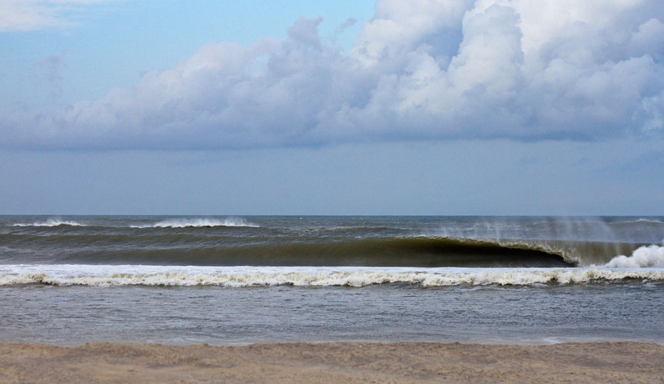 Hurricane Leslie on the Outer Banks. This swell was pretty weird. It was too long of a period for most of the island with the typical spots being closed out. There was one exception, though: a stretch of beach that went mental for a few days straight.  This particular frame is from the tail end of it. Most of the surf world had already headed north and there was just a few of us left.  The lighting this evening was the best I\'ve seen in a while. Photo: <a href=\"https://thewildlyfe.com/\">Eddie Compo/TheWildLyfe</a>