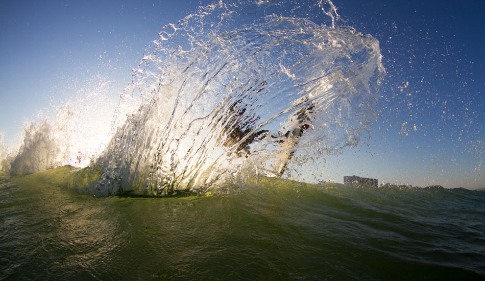 Back home again for some downtime. Tyler and I going for something different. I really like how the light hits the spray but you can still make out the surfer. Photo: <a href=\"https://thewildlyfe.com/\">Eddie Compo/TheWildLyfe</a>