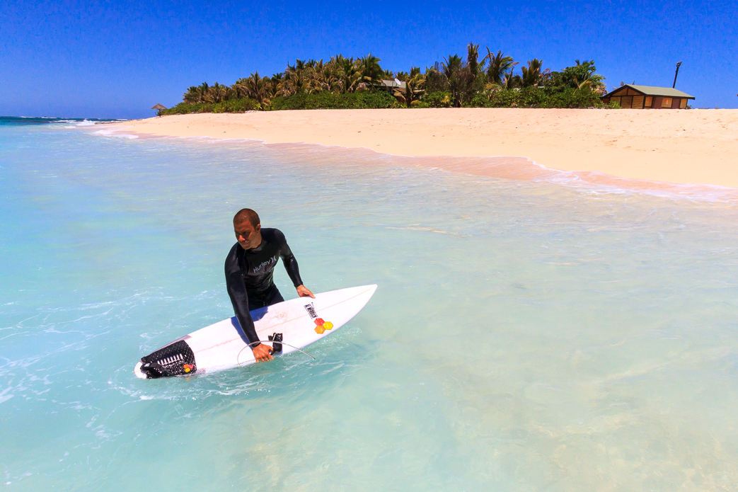 Namotu Lifeguard Tevita Gukilau rinsing off post- cloud break. 