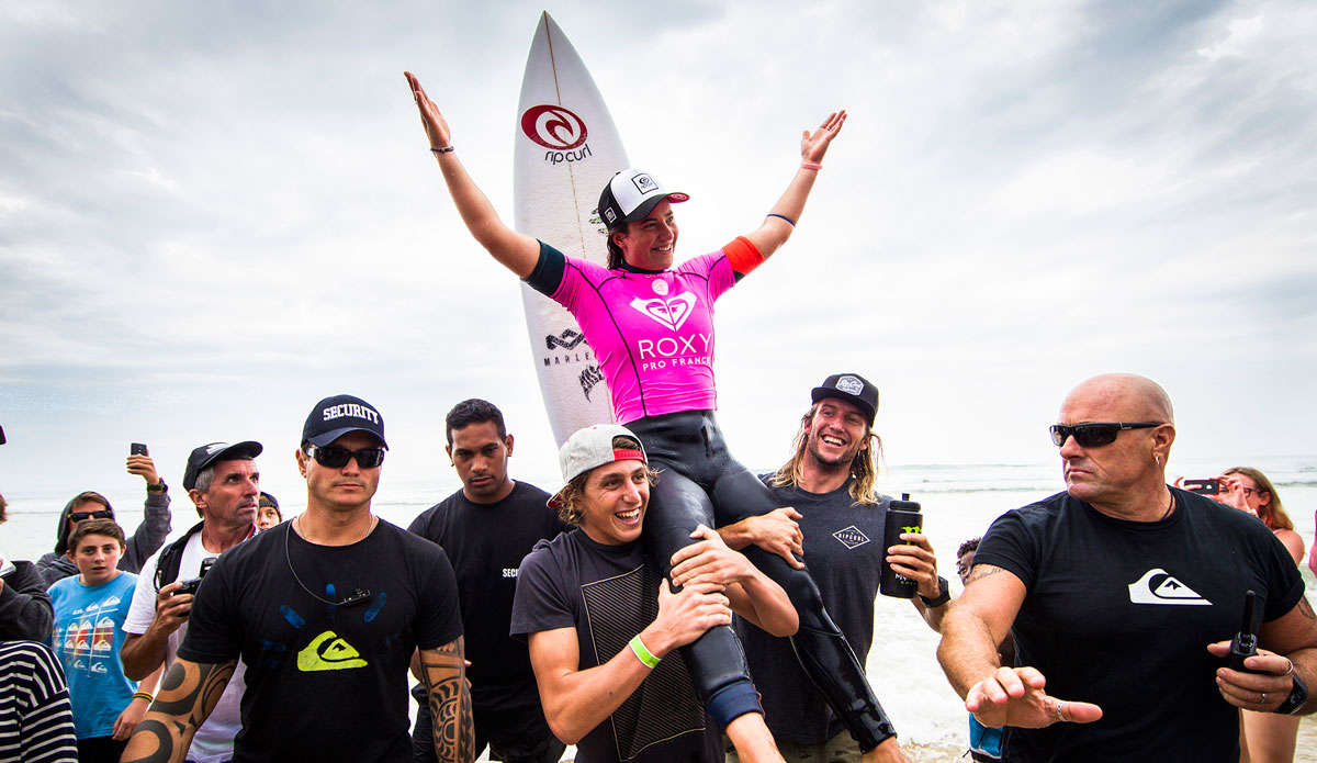 Tyler Wright of Lennox Head, NSW, Australia is chaired up the beach after winning the Roxy Pro France on Sunday September 28, 2014 . Wright defeated Courtney Conlogue (USA) in the Final with a near perfect heat score of 19.20 (out of a possible 20.00). Her victory today marks her first of the 2014 season. Photo: <a href=\"https://www.aspworldtour.com/\">ASP</a>/Poullenot