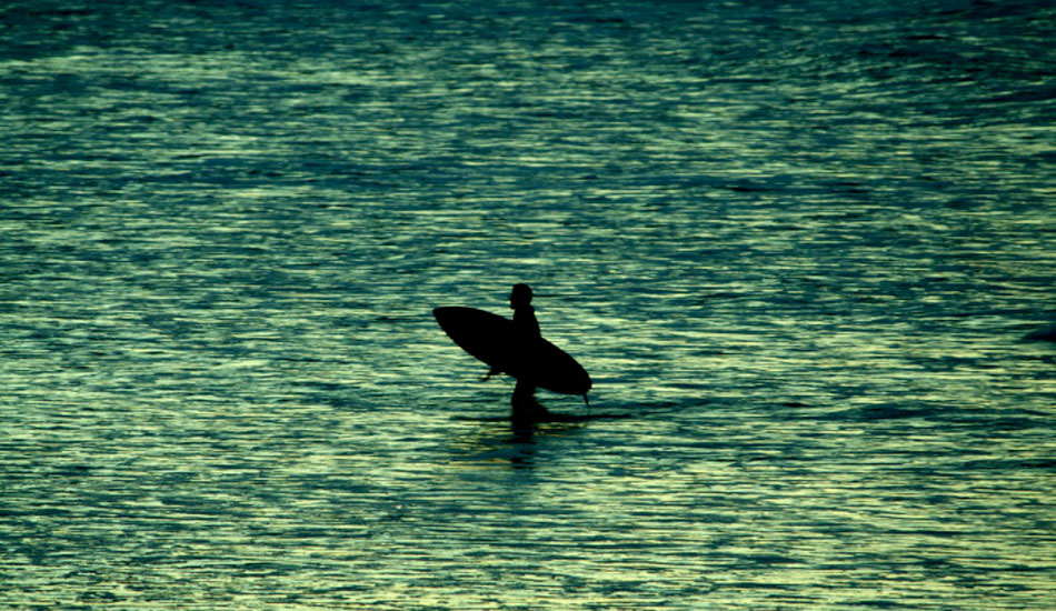 I really like this shot for some reason. The flat beach and area of receding water remind me of so many low tide, sunset sessions. This is Beau Young getting out after a good evening of waves at Kirra. Photo: <a href=\"https://www.korduroy.tv\" target=_blank>Cyrus Sutton</a>.
