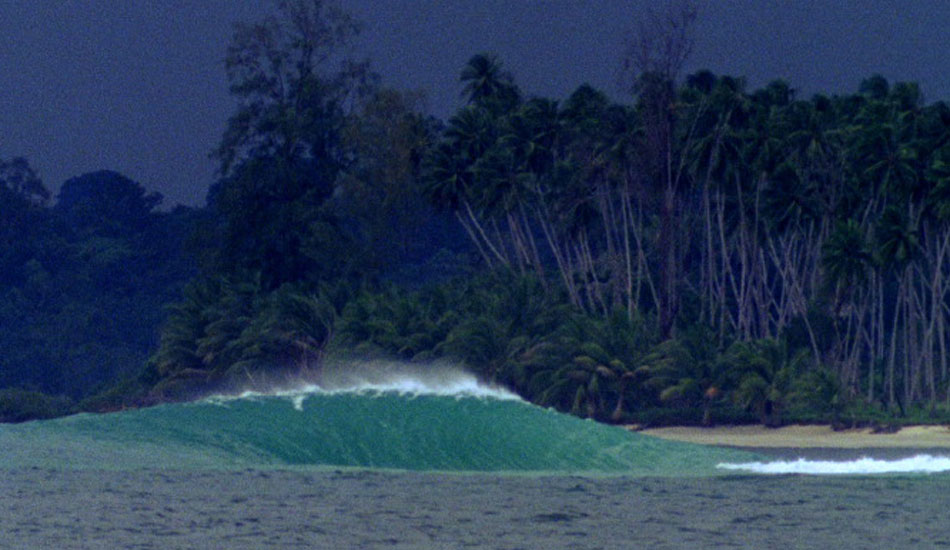 We were (to the best of our knowledge) the first ones to surf this little slab. These small Northern Indonesian islands were first discovered by the crew of our boat only a couple of weeks prior and I can remember sitting on the beach waiting for another set to provide Rasta and Daniel Thomson with more small right peelers when across the bay, a peak popped up and spat over a submerged island. I swung my lens around and refocused just as the second wave did the exact same thing. After a third wave followed suit, I called out to the boat guy in the channel and 30 minutes later we were on the peak for the rest of the afternoon. Photo: <a href=\"https://www.korduroy.tv\" target=_blank>Cyrus Sutton</a>.