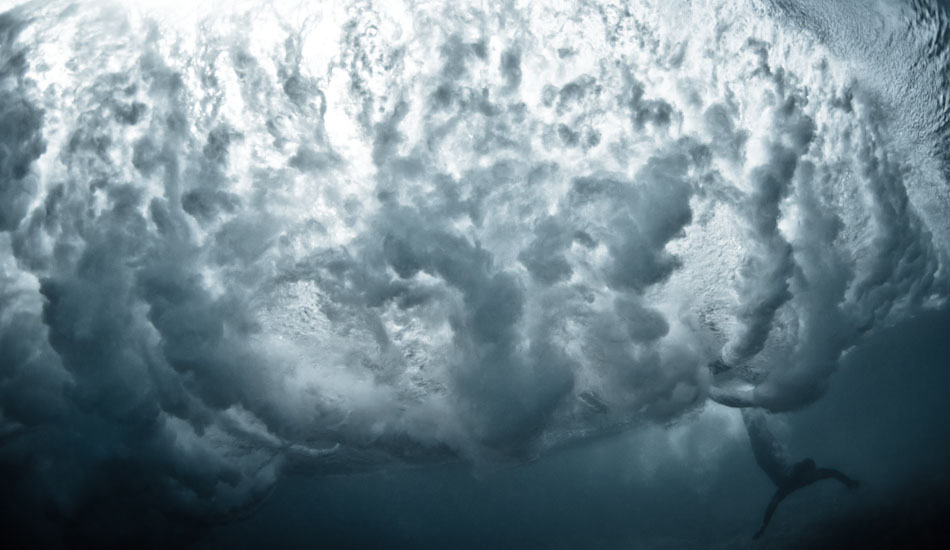 Deep. Scott Lihou stretches for the reef as he tries to avoid the wave above in the remote South Australian outback. “The second trip we\'ve done to South Australia solely for shooting on the reefs. This wave caught us by surprise. We knew it was solid as we paddled out, and got smashed just trying to get through the inside reform. When we made it out the back we only had a few moments to catch our breath before the sets started pulsing. I only shoot in solid waves with people I trust in the water - the wave after this one was bigger…and we weren\'t so lucky.” Photo: <a href=\"https://www.marktipple.com/\" target=_blank>Mark Tipple</a>.