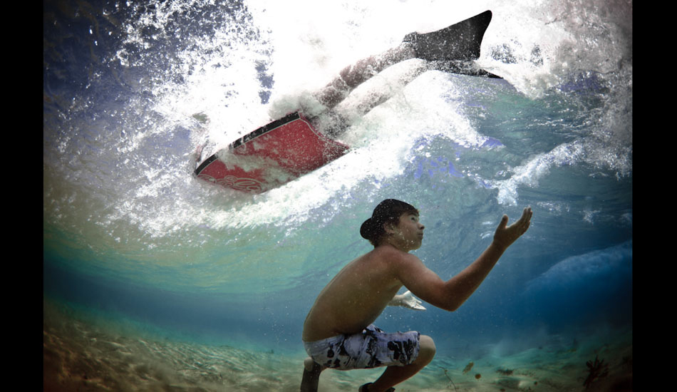 Praise. Local Maroubra grommets play around in the small shorebreak at Maroubra Beach, Sydney. “Even with tiny waves, with water this clear, I couldn\'t resist shooting. I shot some standard photos of the crew in the 39˚ heat. When one swam out wearing a hat, I was super drained from the sun. I just ducked for the bottom as a wave passed, and surfaced with them laughing. I didn\'t realize why until I looked at the screen.” Photo: <a href=\"https://www.marktipple.com/\" target=_blank>Mark Tipple</a>.