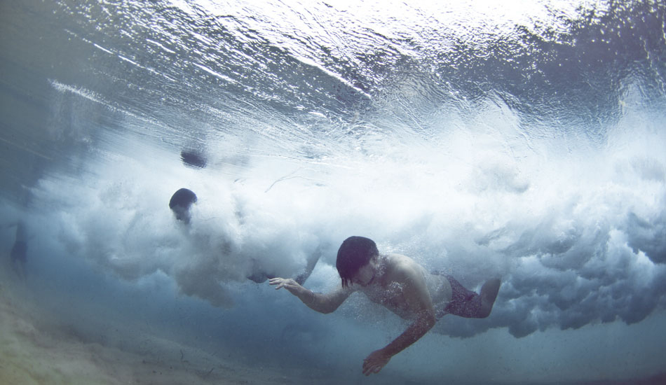 Piano. Two swimmers are engulfed by a breaking wave at Tamarama Beach, Sydney. “A super clear but overcast day made these weird reflections on the roof of the waves, almost a mirror image of the second guy’s head on the water above him. As for the piano, White Houses was in my head for some time after. Still is.” Photo: <a href=\"https://www.marktipple.com/\" target=_blank>Mark Tipple</a>.