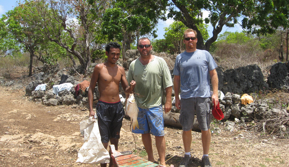 This photo is taken at Chocolate Lake in the center of the island; a great two hour mountain bike excursion. My brother and I with local fisherman. Image: Murphy
 